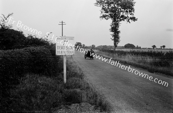 'DEAD SLOW  DEATH TRAP' ROAD SIGN